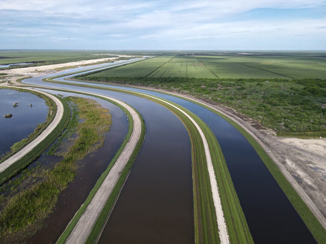 An aerial photo of the Everglades Agricultural Area (EAA) Contract 10. It is the 8-mile inflow/outflow canal (3,000 CFS) and 7-mile seepage canal / maintenance road (Northern Boundary of Reservoir).
The EAA is part of the Central Everglades Planning Project (CEPP) and the Comprehensive Everglades Restoration Plan (CERP). The project will set the foundation for restoring the central portion of the Everglades ecosystem and sending additional water south. CEPP EAA will capture water lost to tide and re-direct water flow south to the central Everglades, Everglades National Park, and Florida Bay. (U.S. Army Photo by Mark Rankin)