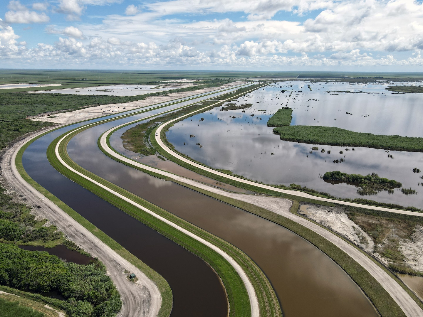 An aerial photo of the Everglades Agricultural Area (EAA) Contract 10. It is the 8-mile inflow/outflow canal (3,000 CFS) and 7-mile seepage canal / maintenance road (Northern Boundary of Reservoir).
The EAA is part of the Central Everglades Planning Project (CEPP) and the Comprehensive Everglades Restoration Plan (CERP). The project will set the foundation for restoring the central portion of the Everglades ecosystem and sending additional water south. CEPP EAA will capture water lost to tide and re-direct water flow south to the central Everglades, Everglades National Park, and Florida Bay. (U.S. Army Photo by Mark Rankin)
