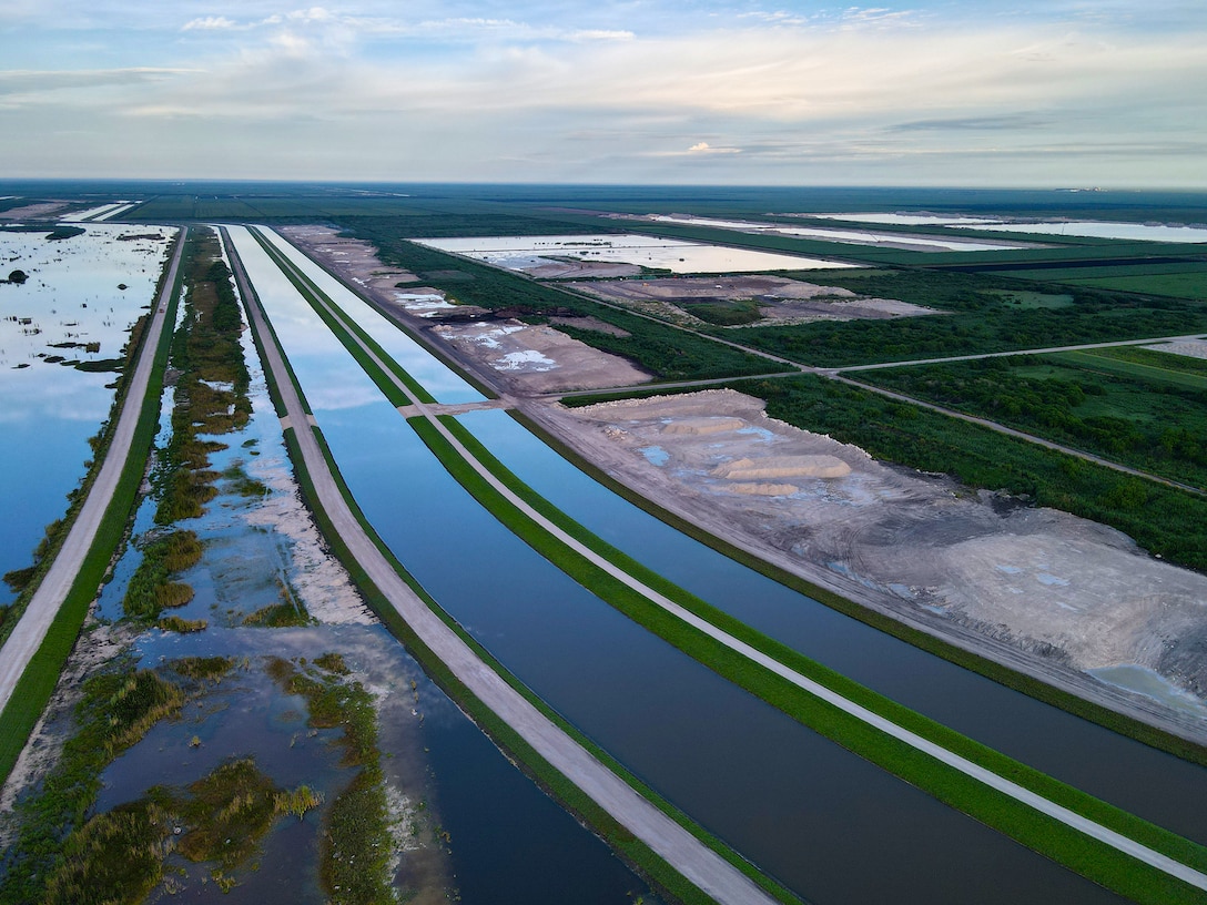 An aerial photo of the Everglades Agricultural Area (EAA) Contract 10. It is the 8-mile inflow/outflow canal (3,000 CFS) and 7-mile seepage canal / maintenance road (Northern Boundary of Reservoir).
The EAA is part of the Central Everglades Planning Project (CEPP) and the Comprehensive Everglades Restoration Plan (CERP). The project will set the foundation for restoring the central portion of the Everglades ecosystem and sending additional water south. CEPP EAA will capture water lost to tide and re-direct water flow south to the central Everglades, Everglades National Park, and Florida Bay. (U.S. Army Photo by Mark Rankin)