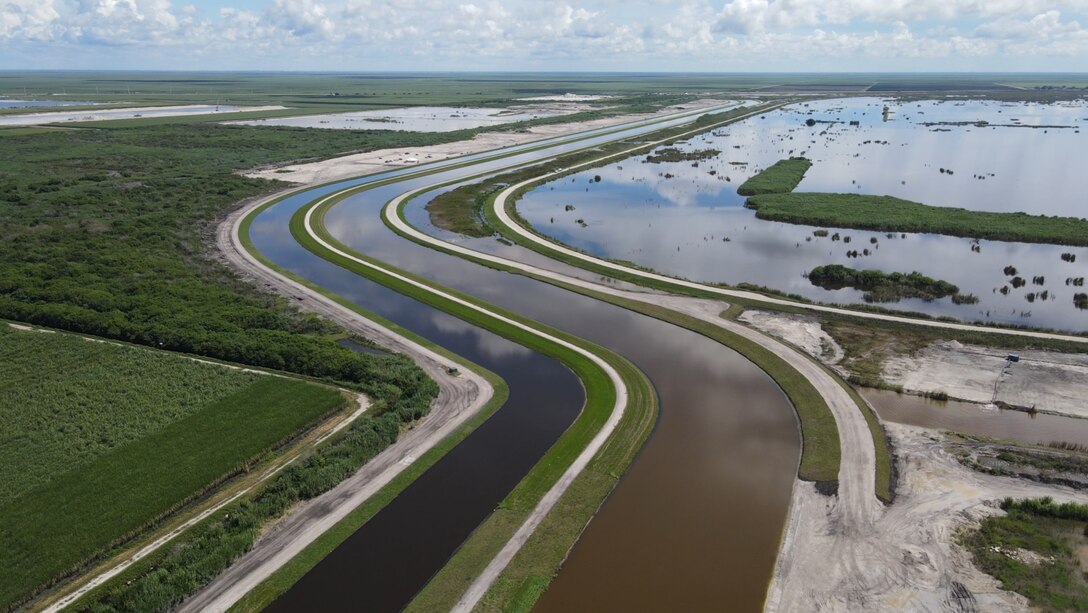 An aerial photo of the Everglades Agricultural Area (EAA) Contract 10. It is the 8-mile inflow/outflow canal (3,000 CFS) and 7-mile seepage canal / maintenance road (Northern Boundary of Reservoir).
The EAA is part of the Central Everglades Planning Project (CEPP) and the Comprehensive Everglades Restoration Plan (CERP). The project will set the foundation for restoring the central portion of the Everglades ecosystem and sending additional water south. CEPP EAA will capture water lost to tide and re-direct water flow south to the central Everglades, Everglades National Park, and Florida Bay. (U.S. Army Photo by Mark Rankin)