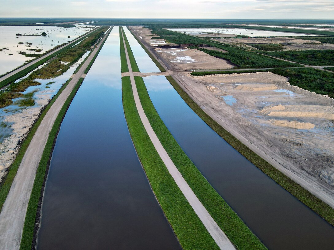 An aerial photo of the Everglades Agricultural Area (EAA) Contract 10. It is the 8-mile inflow/outflow canal (3,000 CFS) and 7-mile seepage canal / maintenance road (Northern Boundary of Reservoir).
The EAA is part of the Central Everglades Planning Project (CEPP) and the Comprehensive Everglades Restoration Plan (CERP). The project will set the foundation for restoring the central portion of the Everglades ecosystem and sending additional water south. CEPP EAA will capture water lost to tide and re-direct water flow south to the central Everglades, Everglades National Park, and Florida Bay. (U.S. Army Photo by Mark Rankin)