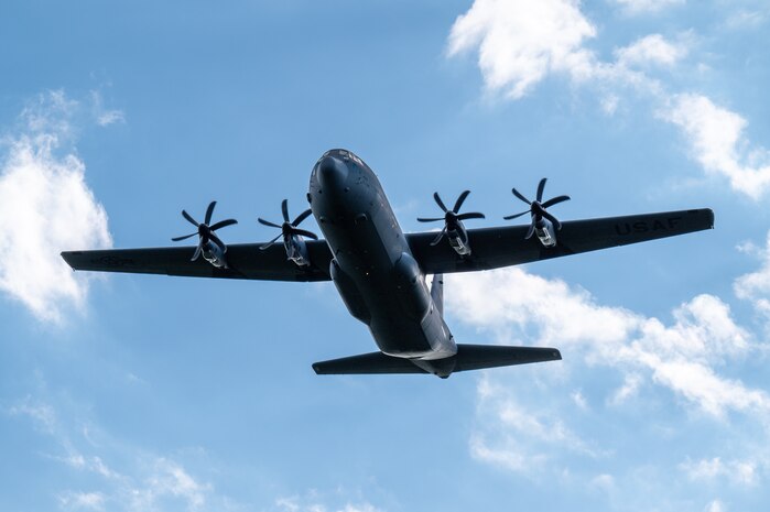 A U.S. Air Force C-130J Super Hercules assigned to the 36th Airlift Squadron flies over Japan Air Self-Defense Force Kenebetsu Air Base, Japan, Sept. 19, 2025, during a High Mobility Artillery Rocket System Rapid Insertion training. Airmen assigned to the 36th AS conducted HIRAIN training as part of a joint operational support mission with U.S. Marines, enabling a bilateral live-fire exercise between the U.S. Marine Corps and the Japan Ground Self-Defense Force. (U.S. Air Force photo by Staff Sgt. Natalie Doan)