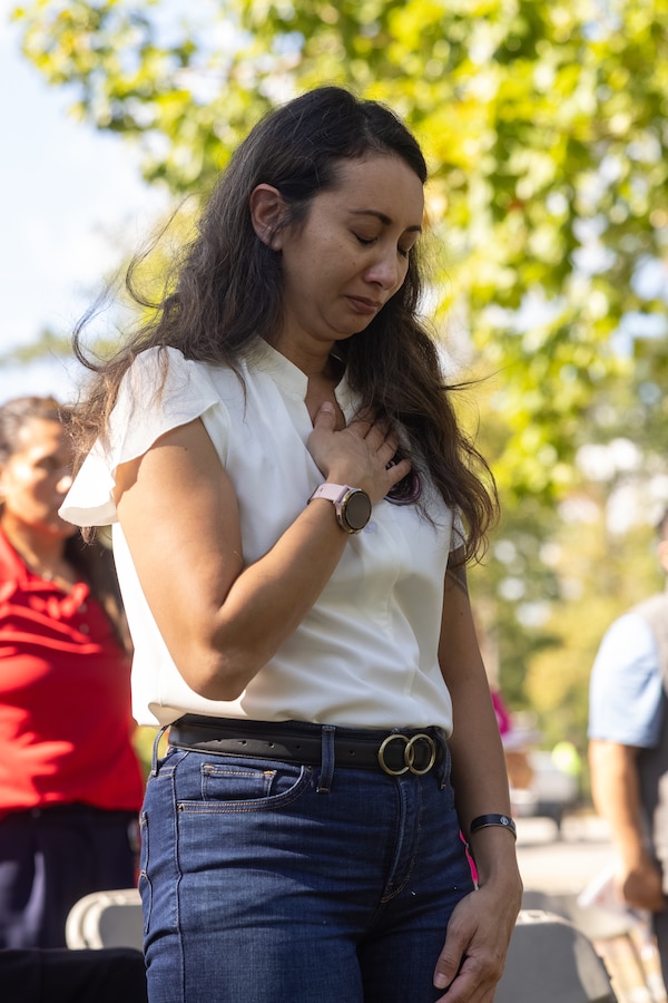A family member of a fallen service member pays tribute during the Bells Across America ceremony at the Lejeune Memorial Gardens in Jacksonville, North Carolina, Sept. 25, 2025. The ceremony was held as part of the Navy Gold Star Program to honor and remember the sacrifice of fallen service members and provide long-term support to their surviving families. This ceremony was the first of its kind in the state of North Carolina. (U.S. Marine Corps photo by Lance Cpl. Alyssa J. DeCrane)