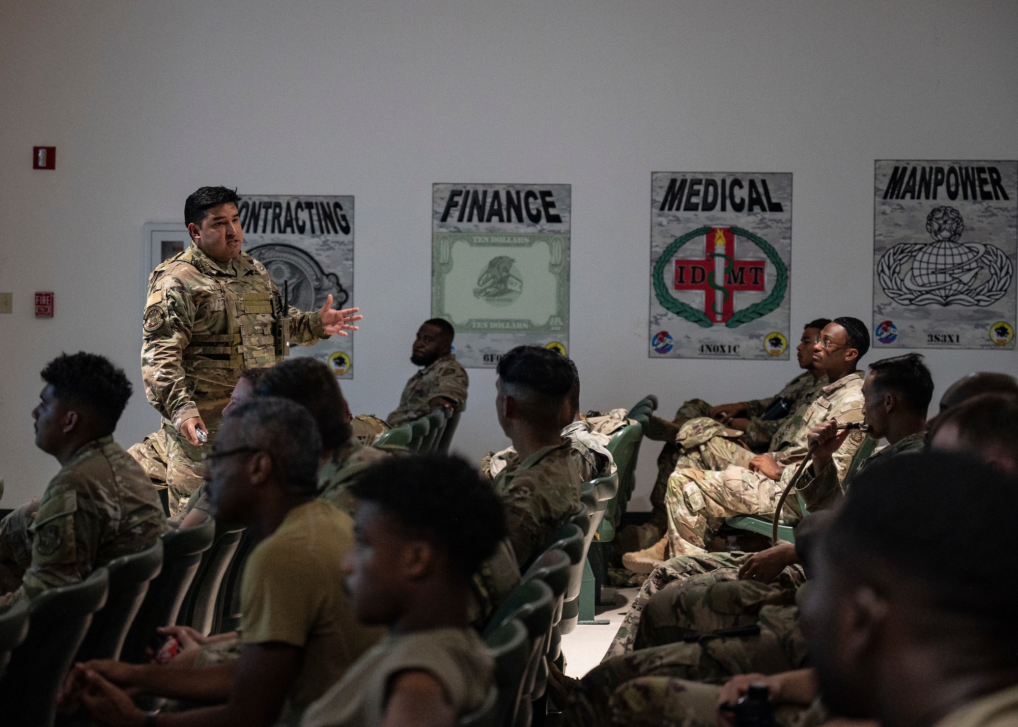 U.S. Air Force Staff Sgt. Bryan Castillo-Castillo, 723rd Combat Air Base Squadron (CABS) emergency management craftsman, discusses the role of the emergency operation center to members of the 23rd Air Task Force and 723rd CABS at the Silver Flag Exercise Site on Tyndall Air Force Base, Fla., Sept. 14, 2025. During classroom training, different AFSCs presented their skill sets to inform and educate other members of the squadron.