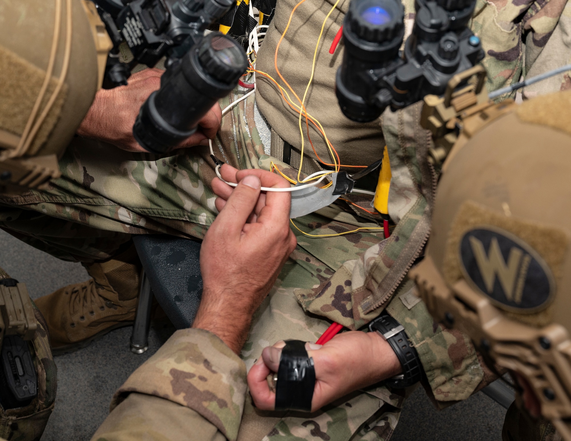 U.S. Air Force explosive ordnance disposal technicians assigned to the 723rd Combat Air Base Squadron simulate diffusing an explosive attached to a hostage during a training exercise at the Silver Flag Exercise Site on Tyndall Air Force Base, Fla., Sept. 16, 2025. The exercise provided realistic training the Airmen needed for their upgrade training.