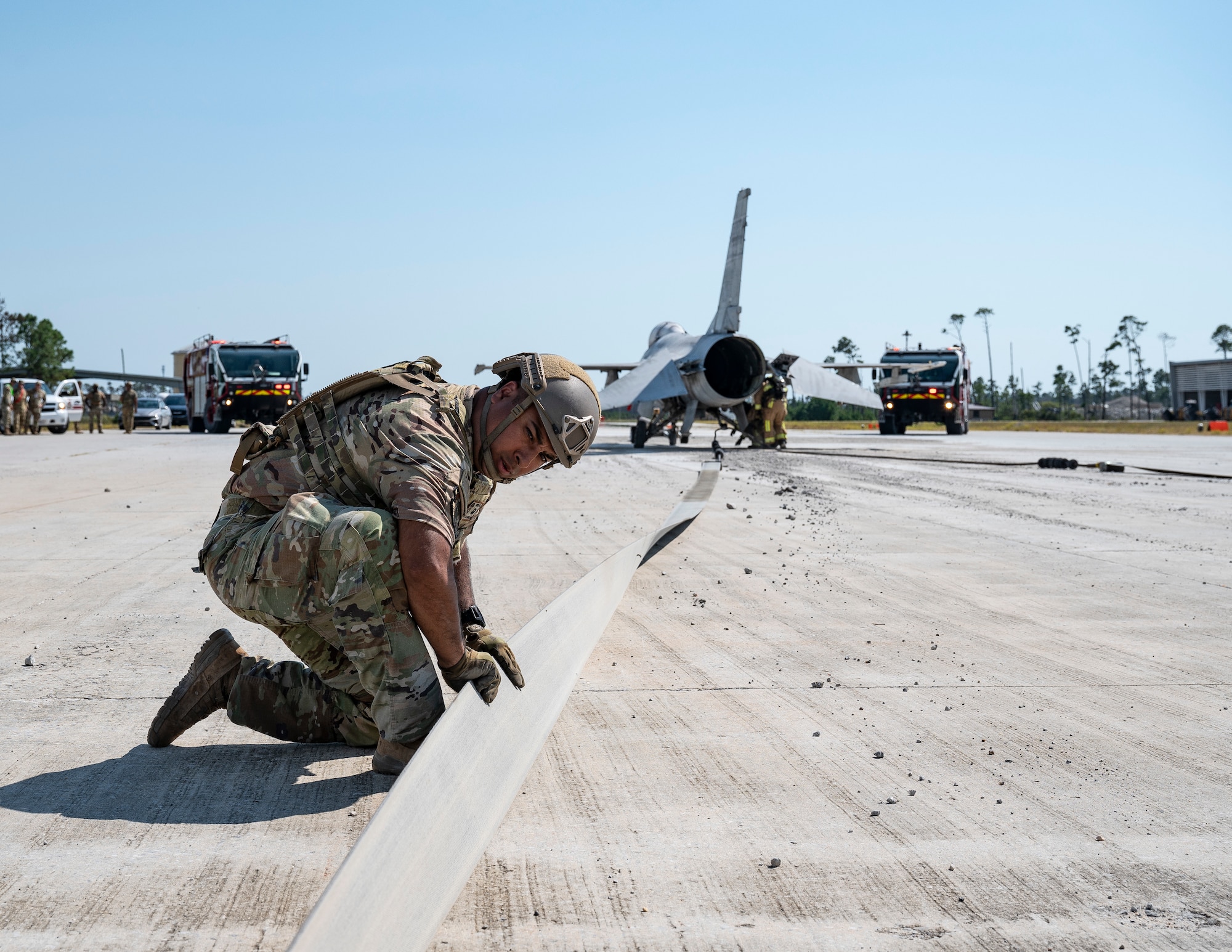 U.S. Air Force Staff Sgt. Daniel Ubau, 723rd Combat Air Base Squadron security forces defender, inspects the aircraft arresting system during a training exercise at the Silver Flag Exercise Site on Tyndall Air Force Base, Fla., Sept. 18, 2025. During the exercise, the Airmen simulated catching an aircraft in the system and ensuring the aircrew’s safety.