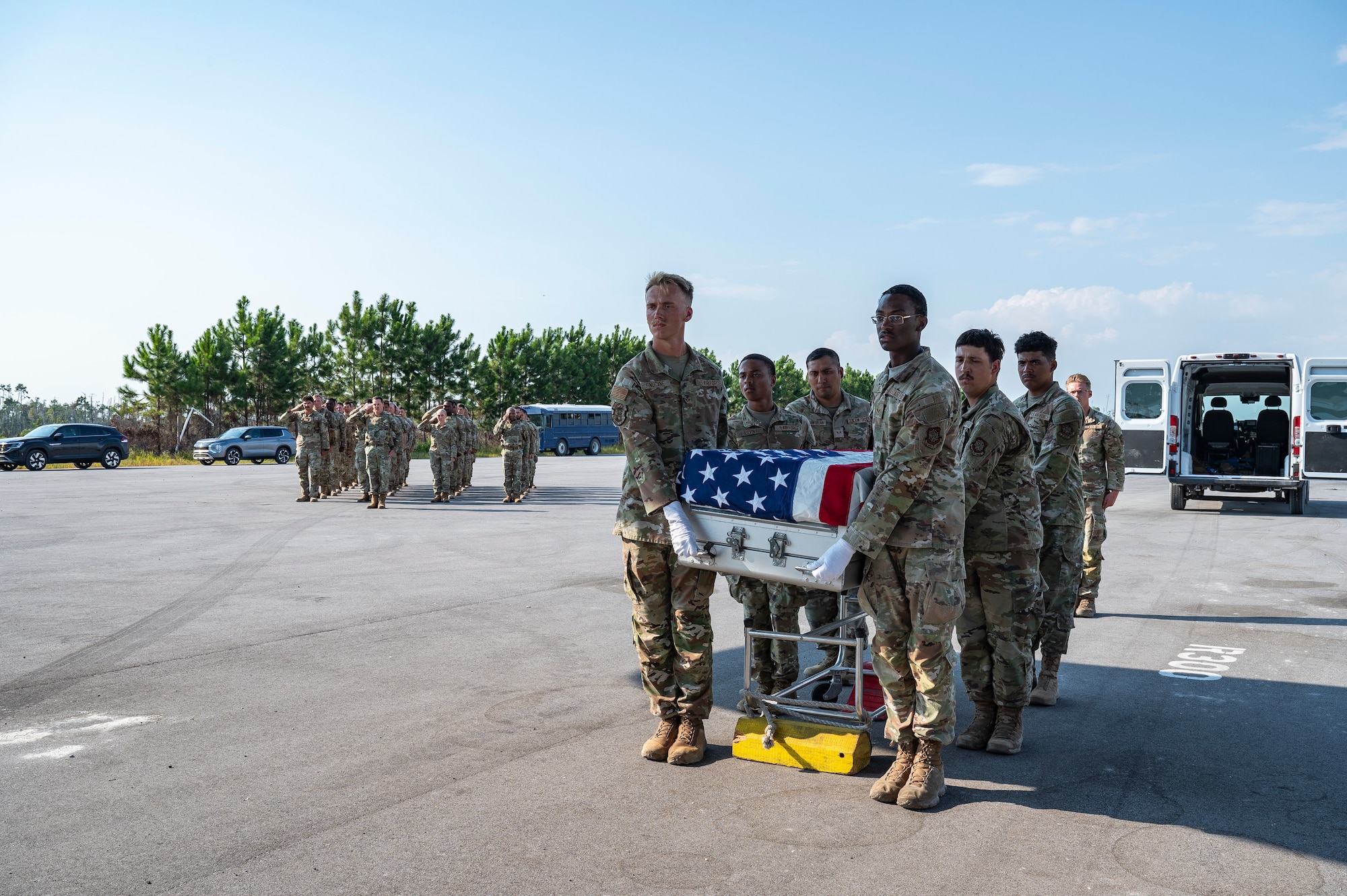 U.S. Air Force Airmen assigned to the 23rd Air Task Force and 723rd Combat Air Base Squadron, simulate a dignified transfer for a deceased service member during a training exercise at the Silver Flag Exercise Site on Tyndall Air Force Base, Fla., Sept. 19, 2025. The Airmen performed honor guard procedures, rendered salutes and simulated loading the deceased onto an aircraft.