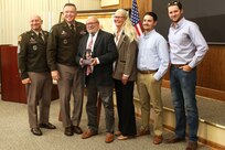 A ceremony marks the return of a historic flag from more than 100 years ago to Pennsylvania National Guard headquarters September 29, 2025, at Fort Indiantown Gap, Pennsylvania. Joseph Reselli, an electrician and lifelong Pennsylvanian who purchased the flag and donated it, presented the flag to Maj. Gen. John R. Pippy, Pennsylvania’s adjutant general, and Command Sgt. Maj. Shawn Phillips, command senior enlisted advisor. It is believed to date from 1920-21, soon after the National Defense Act of 1920 reorganized the U.S. armed forces and formally designated the National Guard, which had previously been known as militias. (U.S. Army National Guard photo by Zane Craig)