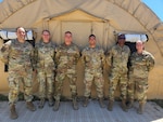 LEAP Scholars and U.S. Army personnel assemble for a photo during the Warrior Engaged exercise at Camp Bullis, Texas. From left to right: USAF Tech. Sgt. Carlos Marrero-Estrada (Spanish LEAP Scholar); U.S. Army Chief Warrant Officer 4 Dale W. Hunter II (HUMINT Readiness); U.S. Army Lt. Col. Christopher L. Bettinger (Battalion Commander); U.S. Air Force 1st Lt. Paulo F. Martinez, (Spanish LEAP Scholar); U.S. Air Force Staff Sgt. Georges A. Yaguibou (French LEAP Scholar); and U.S. Army Staff Sgt. Dorothy A. Sullivan (Intelligence Analyst). (Contributed photo)