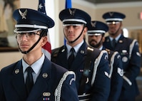 Four members of Honor Guard stand in a line.