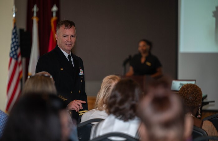 Leadership engages with a crowd of ceremony attendees.
