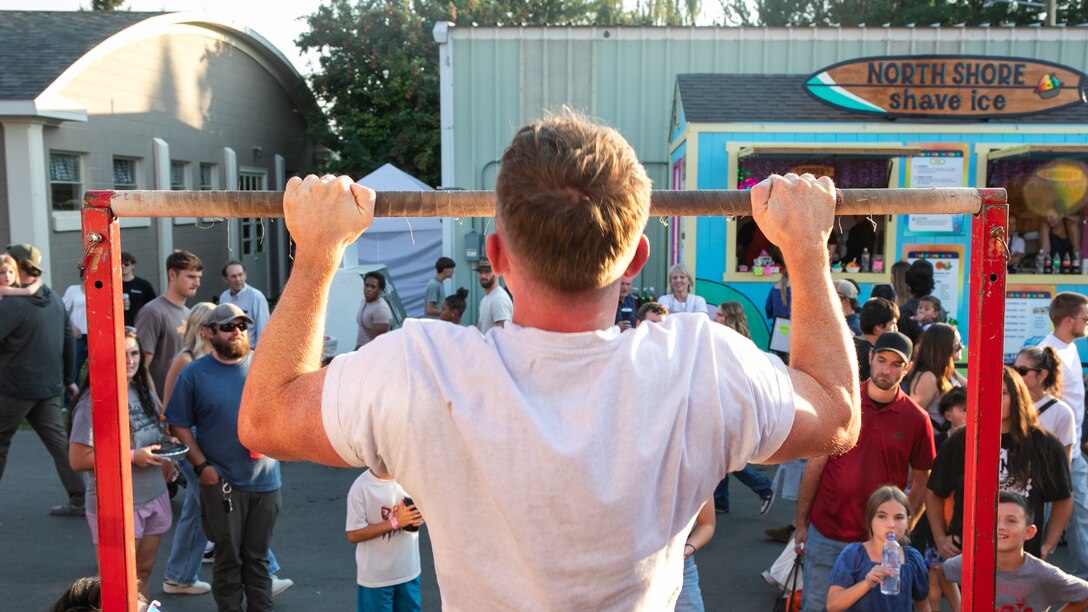 An attendee attempts the pull-up challenge during the Eastern Idaho State Fair in Blackfoot, Idaho, Aug. 29, 2025.