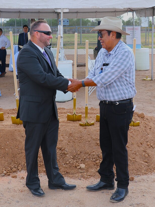 Rick Arvey, project manager with the U.S. Army Corps of Engineers Los Angeles District’s Section 595 Program, left, shakes hands with Pascua Yaqui Tribe Vice Chairman Peter Yucupicio before the Tribe’s Section 595 Project groundbreaking Sept. 16 near Tucson, Arizona.
