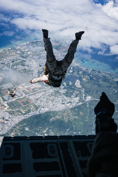 U.S. Marines with Force Reconnaissance Platoon, Maritime Raid Force, 31st Marine Expeditionary Unit, conduct a freefall jump during parachute operations training over Okinawa, Japan, Sep. 26, 2025. T
