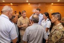 Commander, Joint Task Force - Micronesia U.S. Navy Rear Adm. Josh Lasky, center, speaks with participants following the Commonwealth of the Northern Mariana Islands Stakeholders Meeting in Saipan, Sept. 25.