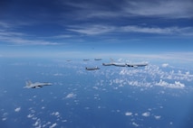 A Royal Australian Air Force (RAAF) KC-30, two U.S. Air Force F-35s, two RAAF F-35s and two Japan Air Self-Defense Force (JASDF) F-15Js fly in formation over the Pacific Ocean prior to the start of Exercise Bushido Guardian (BG) 25 near Misawa Air Base, Japan,  Sept. 26, 2025.