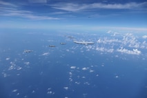 A Royal Australian Air Force (RAAF) KC-30, two U.S. Air Force F-35s, two RAAF F-35s and two Japan Air Self-Defense Force (JASDF) F-15Js fly in formation over the Pacific Ocean prior to the start of Exercise Bushido Guardian (BG) 25 near Misawa Air Base, Japan,  Sept. 26, 2025.