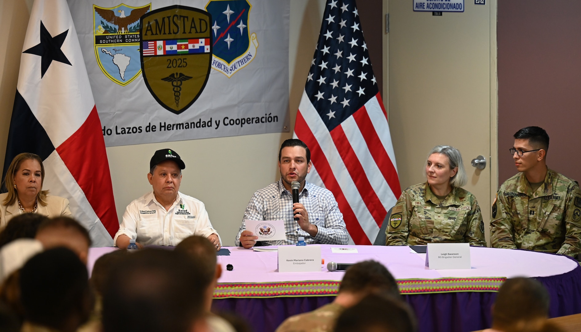 Image of a group talking at a table.