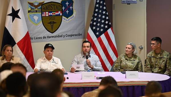 Image of a group talking at a table.