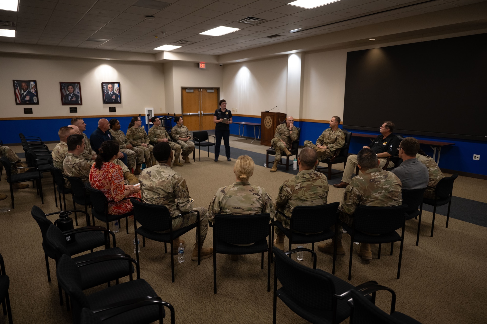 Participants in the Warhawk Leadership Course are seated in a circle, alongside 37th Training Wing senior leaders.