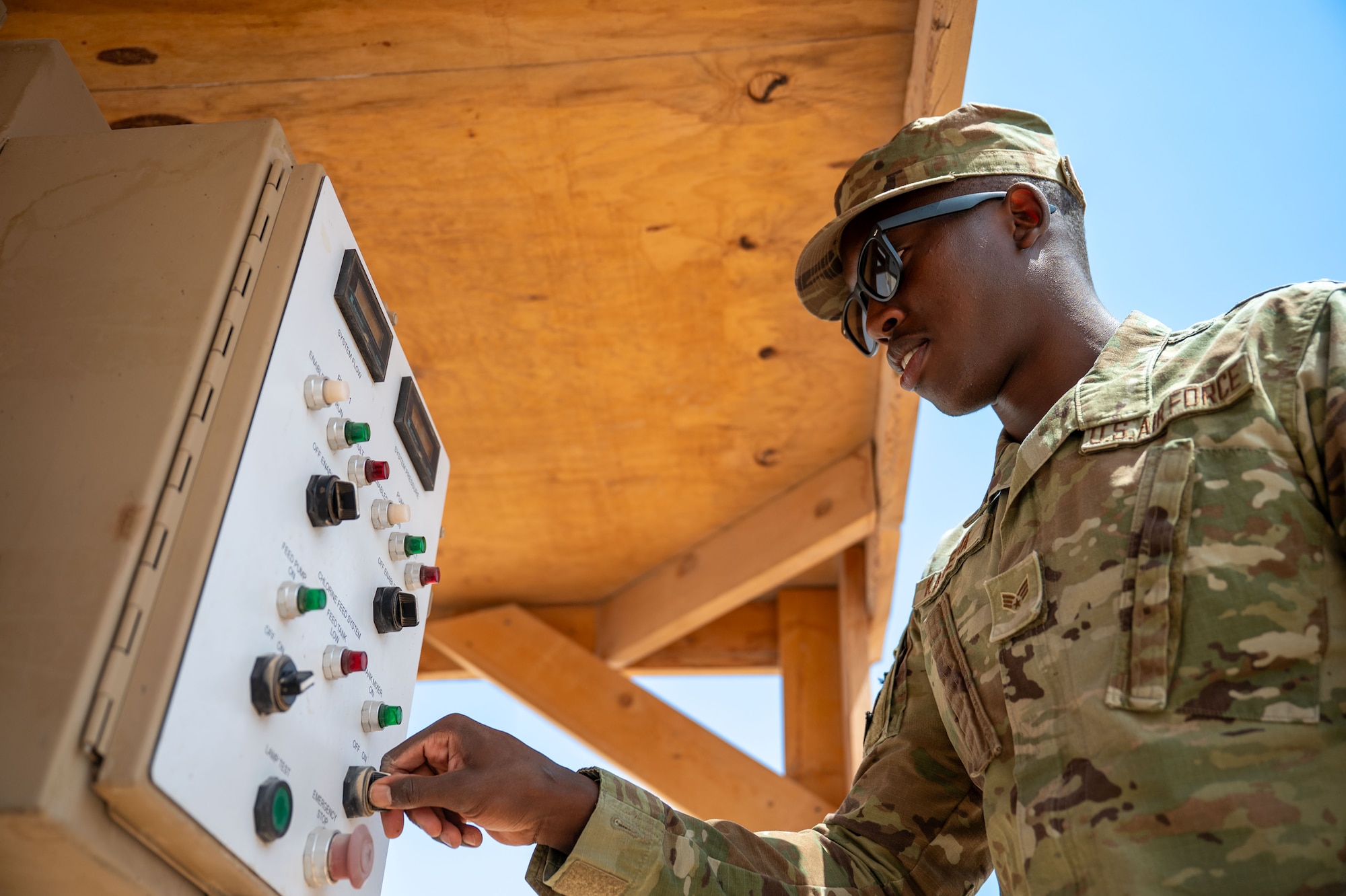 U.S. Air Force Senior Airman Daniel Kapsetta, 378th Expeditionary Civil Engineer Squadron water and fuel systems maintenance journeyman, turns on a water pump.