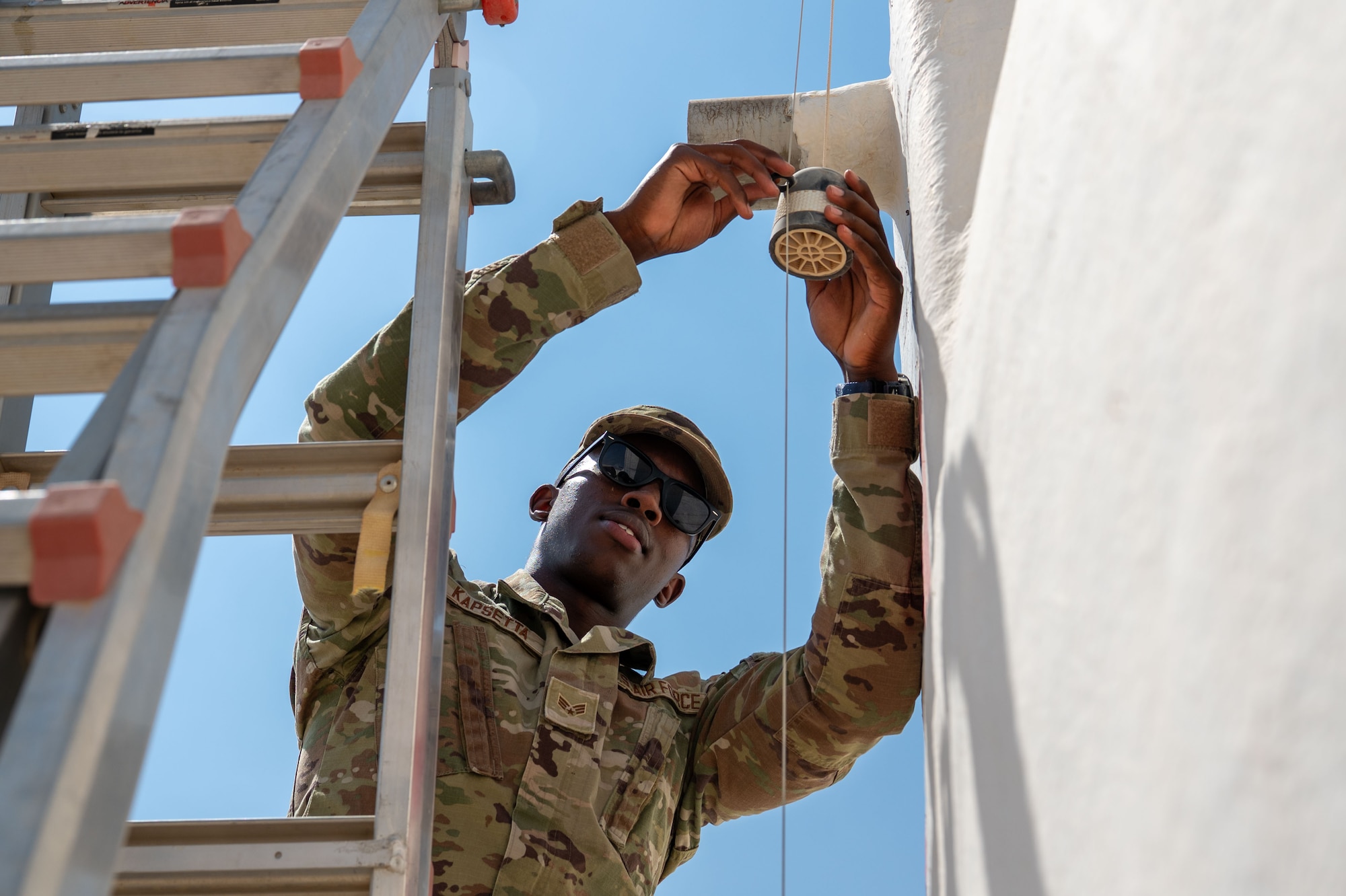 U.S. Air Force Senior Airman Daniel Kapsetta, 378th Expeditionary Civil Engineer Squadron water and fuel systems maintenance journeyman, inspects a water-level float.