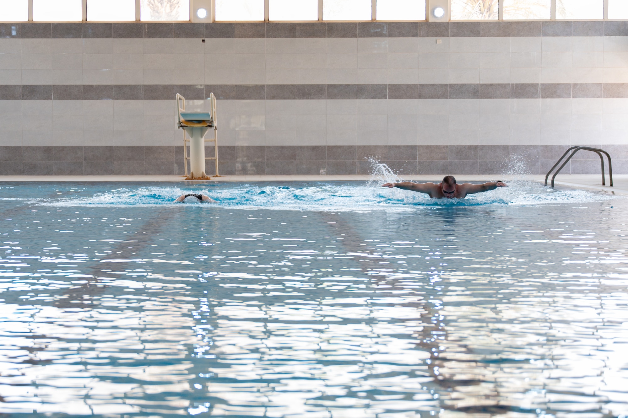 Two Airmen swim
