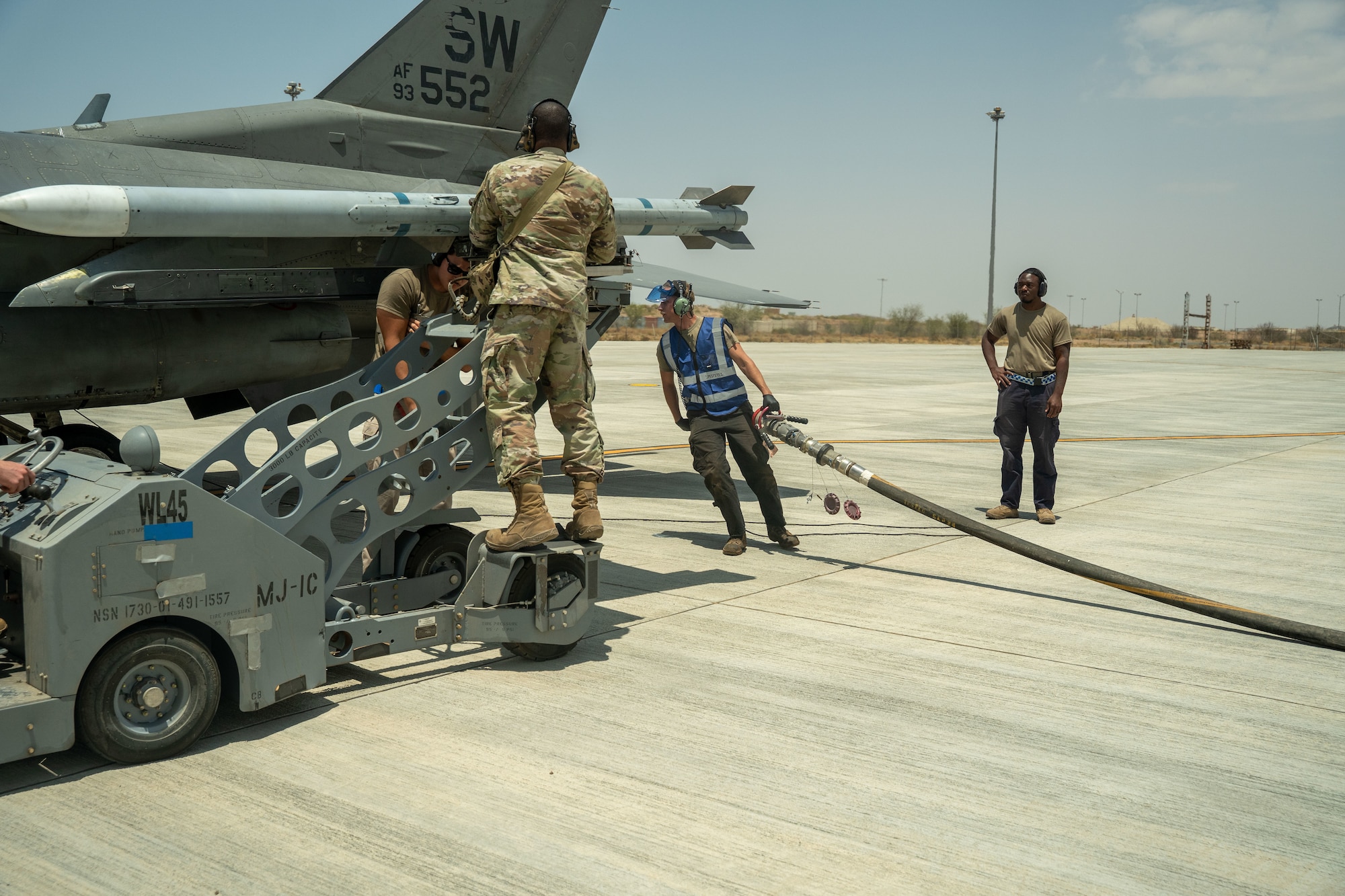 U.S. Airmen assigned to the 55th Expeditionary Fighter Generation Squadron conduct a simulated integrated combat turn.