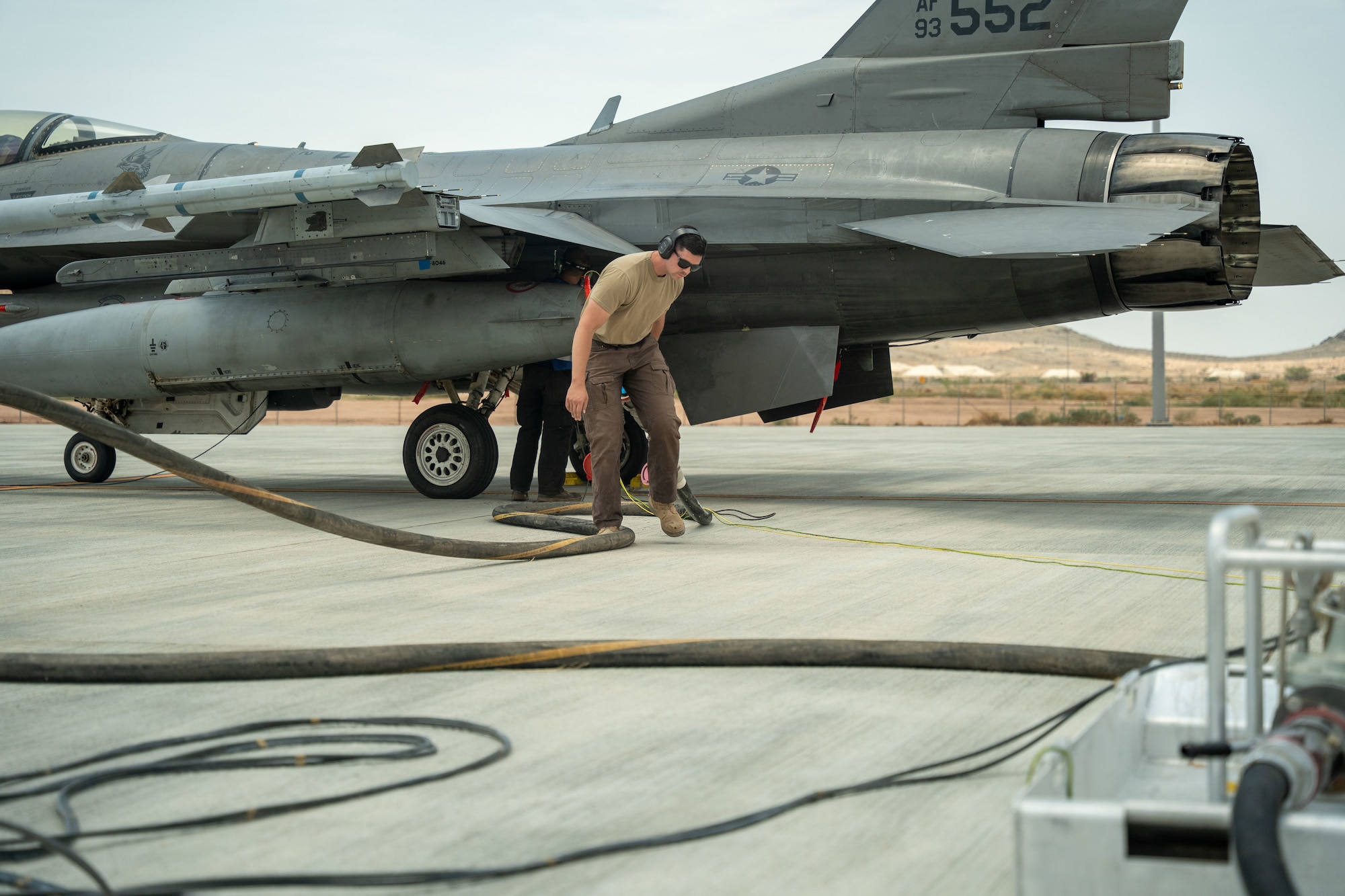 U.S. Air Force Staff Sgt. Josh Runyan, 378th Expeditionary Logistics Readiness Squadron Petroleum, Oils, and Lubricants Flight fuels equipment maintenance noncommissioned officer in charge, removes a fuel hose after a simulated integrated combat turn.
