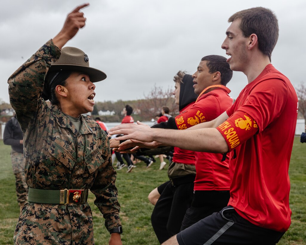 U.S. Marine Corps Sgt. Miral Tsosie, a drill instructor with Delta Company, 1st Recruit Training Battalion, Marine Corps Recruit Depot Parris Island, gives instructions to a poolee during the Recruiting Station Baltimore statewide pool function at the United States Naval Academy, Annapolis, Maryland, April 12, 2025. The statewide pool function served as an opportunity for future Marines to build camaraderie and experience firsthand some of the rigors they will face during recruit training. (U.S. Marine Corps photo by Sgt. Jennifer Delacruz)