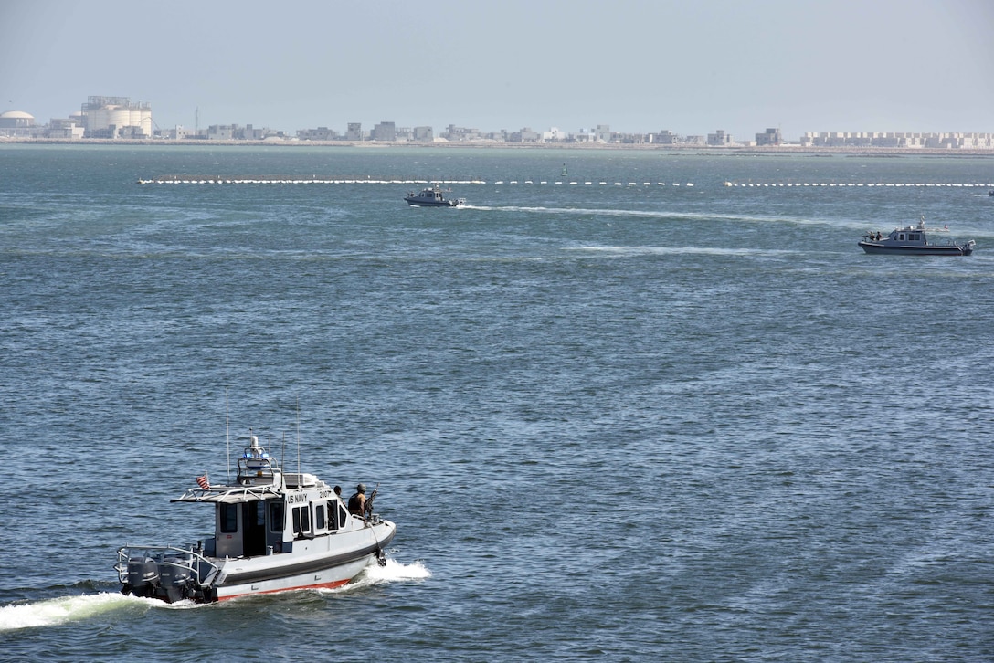 33-foot Force Protection-Medium (FP-M) Harbor Security Boats (HSB), attached to Naval Support Activity (NSA) Bahrain, respond to a small boat probe attack during a force protection drill, Sept. 29, 2025. Force protection drills are critical to reinforce and refine pre-planned responses and standard operating procedures in response to various potential threats. NSA Bahrain enables the forward operations and responsiveness of U.S. and allied forces in support of the Navy Region Europe, Africa, Central mission to provide services to the fleet, warfighter and family. (U.S. Navy photo by Lt. Bryan Blair)