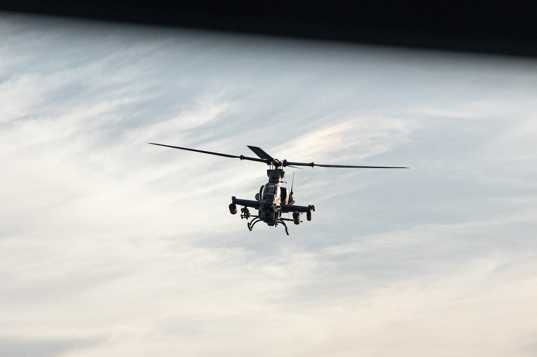 CARIBBEAN SEA – A U.S. Marine Corps AH-1Z Cobra helicopter with Marine Medium Tiltrotor Squadron (VMM) 263 (Reinforced), 22nd Marine Expeditionary Unit (Special Operations Capable), participates in a live fire exercise from aboard the Wasp-class amphibious assault ship USS Iwo Jima (LHD 7), while underway in the Caribbean Sea, Sept. 16, 2025. U.S. military forces are deployed to the Caribbean in support of the U.S. Southern Command mission, Department of War-directed operations, and the president’s priorities. (U.S. Marine Corps photo by Cpl. Emily Hazelbaker)