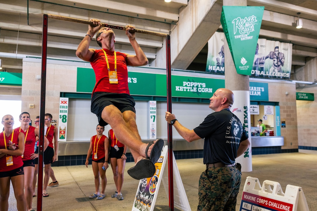 U.S. Marines with Recruiting Sub-Station Denton, Recruiting Station Fort Worth, 8th Marine Corps District, attend the Drum Corps International event to support the Musician Enlistment Option Program (MEOP) at the University of North Texas, Denton, Texas, July 17, 2025.