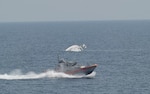 Two men are rescued by the USCGC Calhoun (WMSL 759) crew, June 12, 2025 from a life raft after their 57-foot sport fisher vessel, Turn Me Loose, sank 34 miles southeast of Virginia Beach, Virginia. The father and son activated their Emergency Position Indicating Radio Beacon (EPIRB), which allowed rescue crews to pinpoint their location and safely recover them. (U.S. Coast Guard photo by Lt. j.g. Adam Warren)