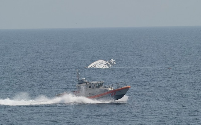 Two men are rescued by the USCGC Calhoun (WMSL 759) crew, June 12, 2025 from a life raft after their 57-foot sport fisher vessel, Turn Me Loose, sank 34 miles southeast of Virginia Beach, Virginia. The father and son activated their Emergency Position Indicating Radio Beacon (EPIRB), which allowed rescue crews to pinpoint their location and safely recover them. (U.S. Coast Guard photo by Lt. j.g. Adam Warren)
