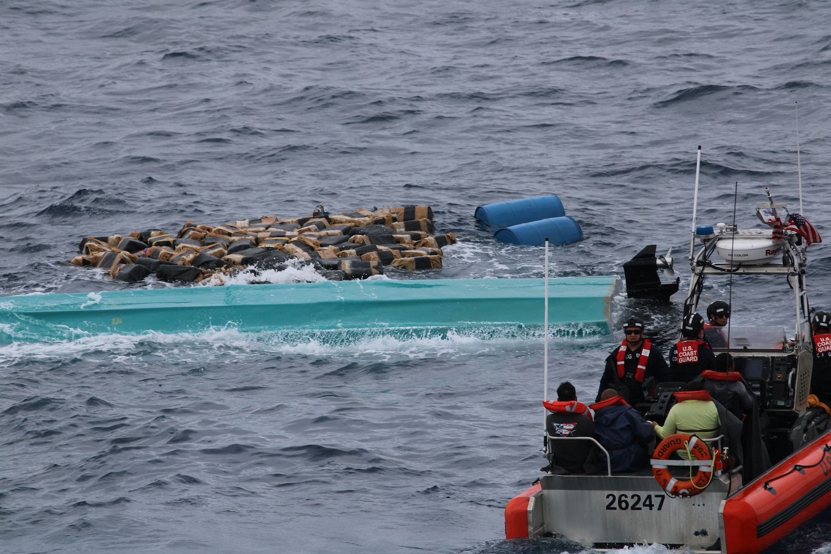The crew of the U.S. Coast Guard Cutter Seneca (WMEC 906) recovers bales of cocaine after a suspected drug smuggling vessel capsized in the Pacific Ocean, Sept. 17, 2025. Seneca’s crew worked alongside interagency partners to interdict illicit narcotics in the international waters in the Eastern Pacific Ocean.  (U.S. Coast Guard photo)