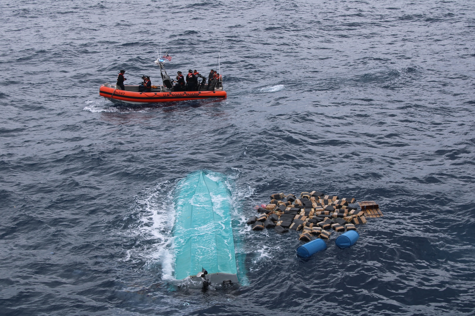 The crew of the U.S. Coast Guard Cutter Seneca (WMEC 906) recovers bales of cocaine after a suspected drug smuggling vessel capsized in the Pacific Ocean, Sept. 17, 2025. Seneca’s crew worked alongside interagency partners to interdict illicit narcotics in the international waters in the Eastern Pacific Ocean.  (U.S. Coast Guard photo)