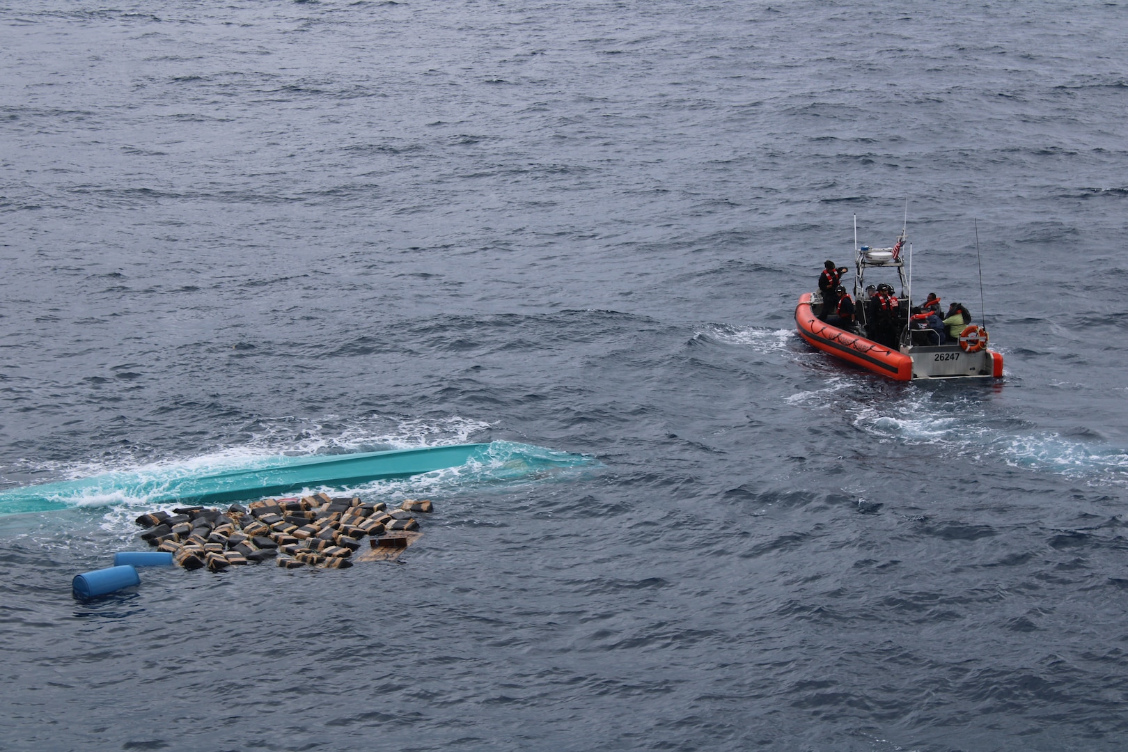 The crew of the U.S. Coast Guard Cutter Seneca (WMEC 906) recovers bales of cocaine after a suspected drug smuggling vessel capsized in the Pacific Ocean, Sept. 17, 2025. Seneca’s crew worked alongside interagency partners to interdict illicit narcotics in the international waters in the Eastern Pacific Ocean. (U.S. Coast Guard photo)