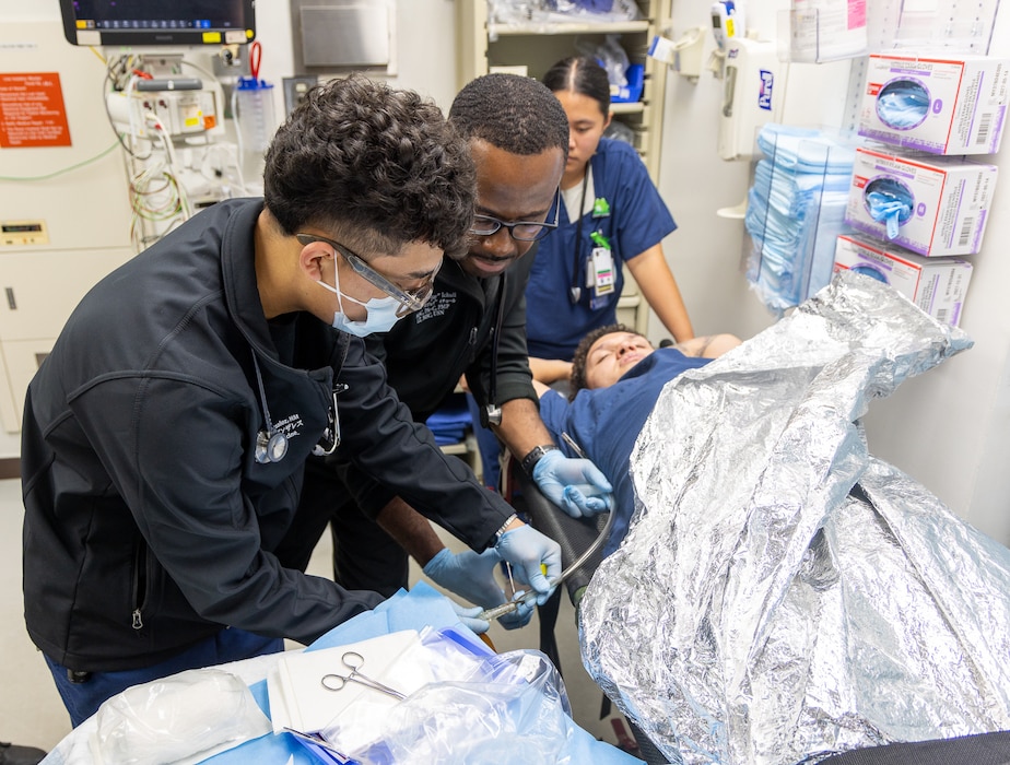 YOKOSUKA, Japan (Sept. 23, 2025) – U.S. Navy Medicine Readiness and Training Command (USNMRTC) Yokosuka personnel treat a simulated patient in the Emergency Room during a mass casualty drill. The drill tested the hospital’s ability to provide critical medical care during a simulated catastrophic event. (U.S. Navy photo by Ai Hazama/USNMRTC Yokosuka Public Affairs)