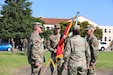 Maj. Gen. Windsor S. Buzza, incoming commanding general of U.S. Army Reserve “Blood and Fire” Soldiers of 63rd Readiness Division, accepts the division colors from Commanding General of the U.S. Army Reserve Command, Lt. Gen. Robert E. Harter during a change of command ceremony signifying his newly assigned role at 63rd RD, Sept. 27, 2025, at Moffet Field, Mountain View, Calif. The 63rd Readiness Division specializes in real property management, maintenance readiness, public affairs, and administrative support, providing support to approximately 40,000 Army Reserve Soldiers. (U.S. Army photo by Staff Sgt. Karen Sampson)
