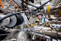 Nicholas Sirica, Ph.D., U.S. Naval Research Laboratory physicist, tunes a monochromator for an ultraviolet light source to characterize materials in a cluster system in Washington, D.C., Sept. 18, 2025. Sirica uses the cluster system to grow and characterize quantum materials for the fabrication of nanoscale devices with unique functionalities. (U.S. Navy photo by Sarah Peterson)