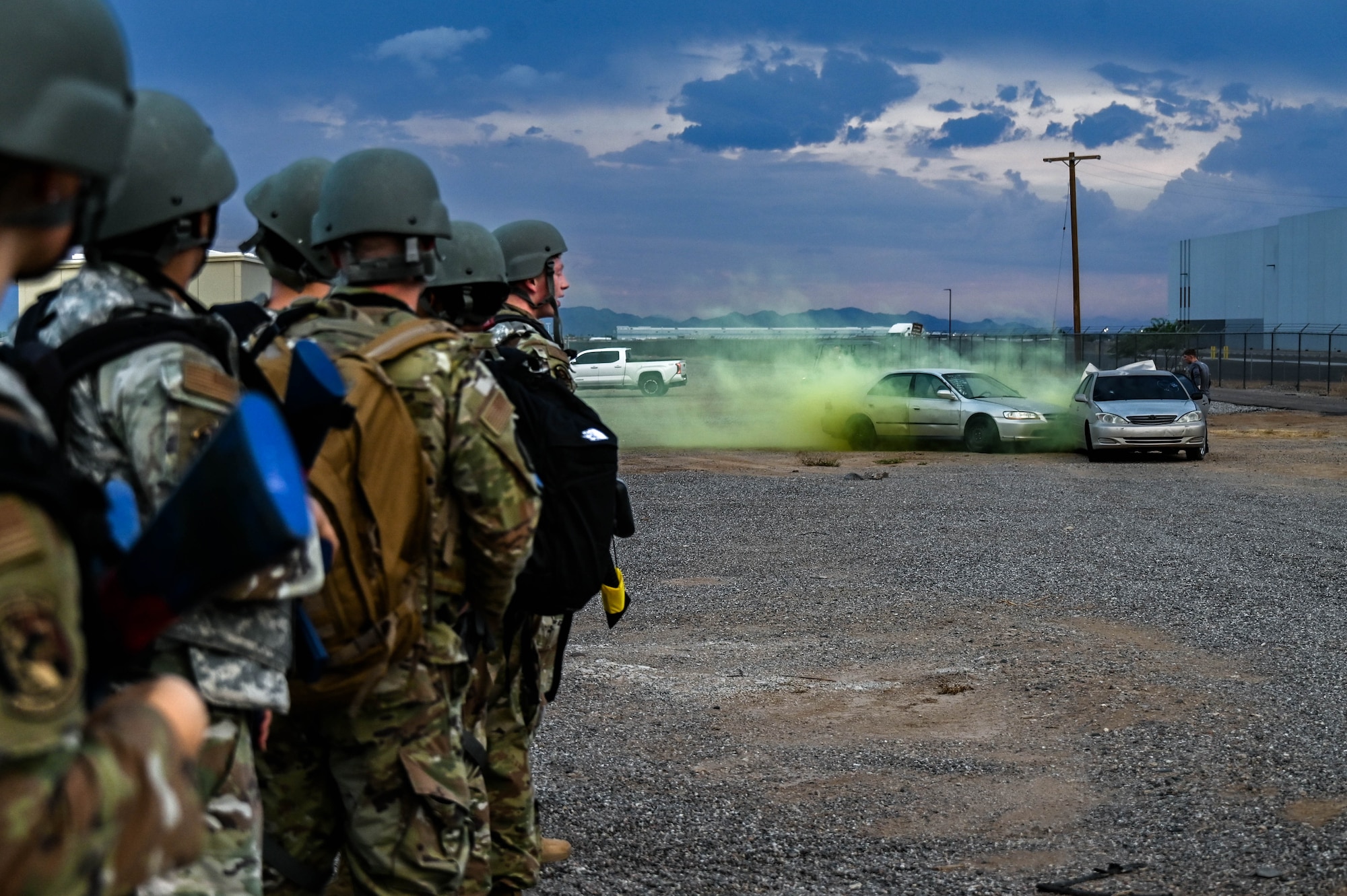 U.S. Air Force Airmen assigned to the 56th Fighter Wing observe a simulated attack during an Ability to Survive and Operate overnight field exercise