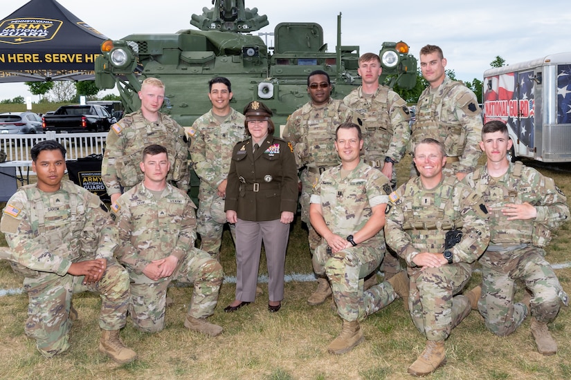 Deputy Adjutant General-Army Brig. Gen. Laura McHugh poses with Soldiers from the Pennsylvania Army National Guard Ambassador Demonstration Team, Recruiting and Retention Battalion and Soldier Services Division at the Big 33 Football Classic May 28, 2023, at Bishop McDevitt High School. (Pennsylvania National Guard photo by Wayne V. Hall)