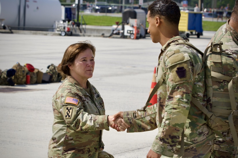 Maj. Gen. Laura McHugh, Deputy Adjutant General-Army, Pennsylvania National Guard, greets a Soldier with 1st Battalion, 111th Infantry Regiment, 56th Stryker Brigade Combat Team upon his return from a year-long deployment to Africa at Harrisburg International Airport in Middletown, Pennsylvania, July 10, 2025. (U.S. Army National Guard photo by Maj. Travis Mueller)
