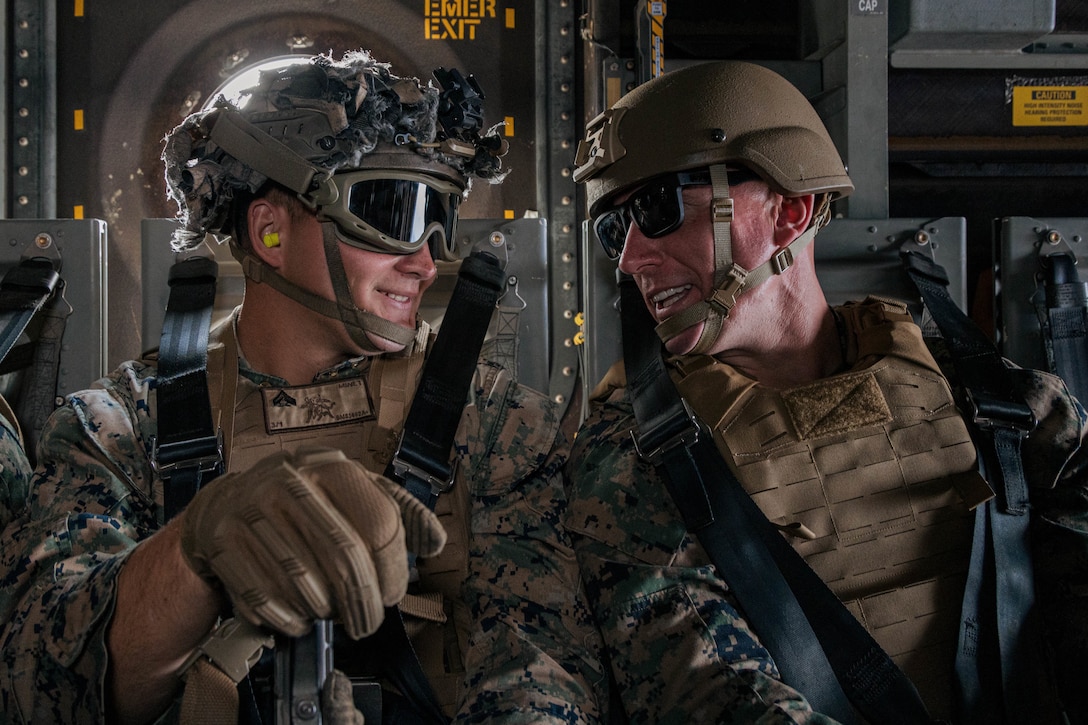 U.S. Marine Corps Sgt. Dakota Meyer, right, a Medal of Honor recipient and a rifleman with 4th Reconnaissance Battalion, 4th Marine Division, and Cpl. Brandon Minet, a fire team leader with with 2nd Battalion, 4th Marine Regiment, 1st Marine Division, ride in a MV-22B Osprey assigned to Marine Medium Tiltrotor Squadron (VMM) 362, Marine Aircraft Group 16, 3rd Marine Aircraft Wing, during the Marine Air-Ground Task Force demonstration during the 2025 Marine Corps Air Station Miramar Air Show in San Diego, Sept. 27, 2025. The MAGTF Demo displays the coordinated use of close-air support, armor, artillery and infantry forces and provides a visual representation of how the Marine Corps operates. America's Air Show 2025 is a unique and incredible opportunity to witness Marine and joint aviation capabilities, civilian performers and the world-famous Blue Angels; to celebrate the 250th birthday of the Marine Corps alongside Marines and to see first-hand the innovative spirit of the Marine Corps through emerging technologies and forward-thinking. (U.S. Marine Corps photo by Cpl. Sarah M. Grawcock)