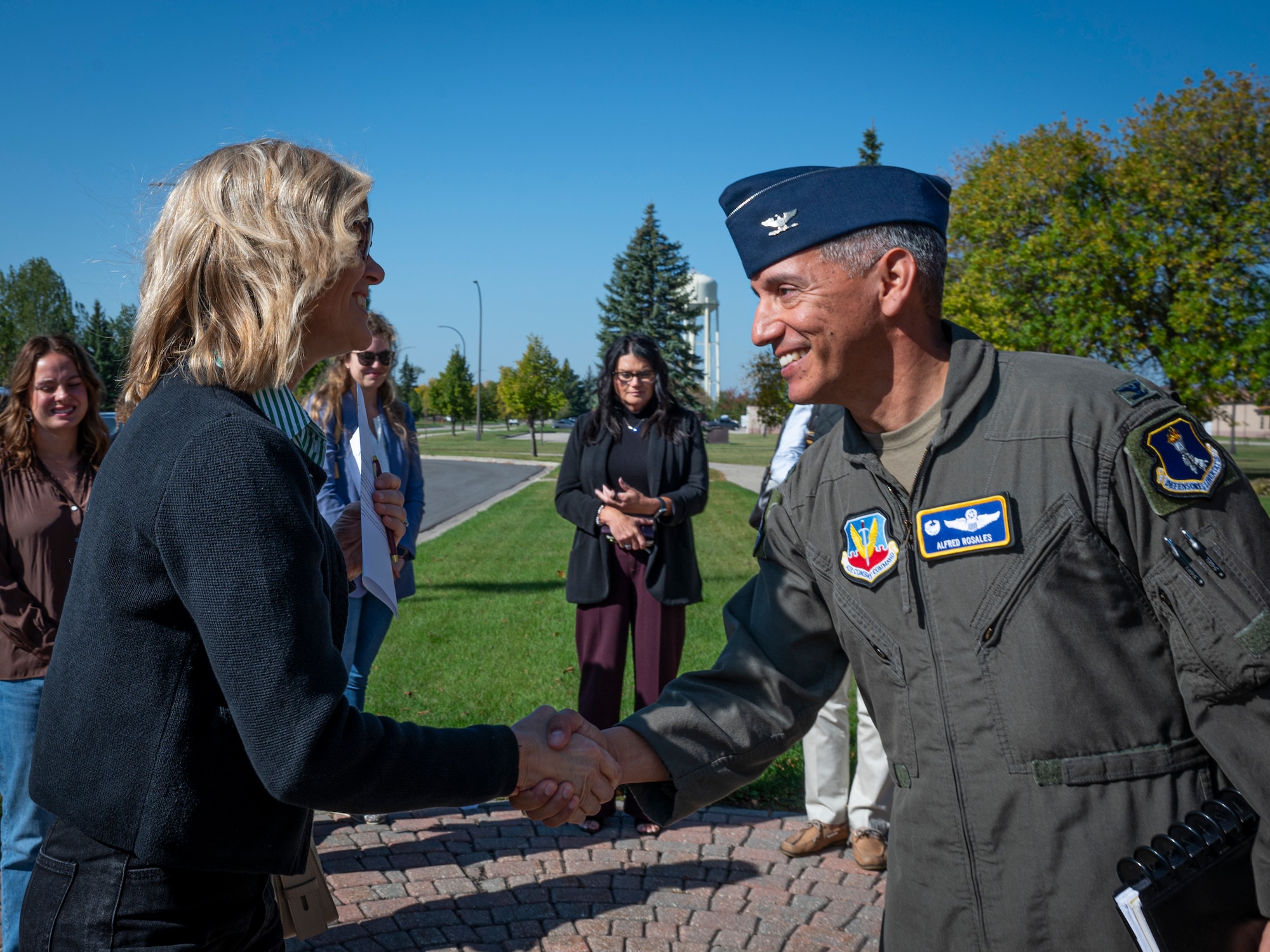 A photo of two people shaking hands.