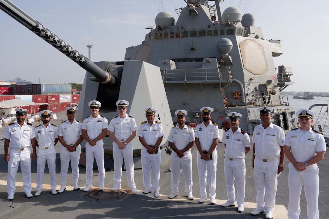 KARACHI, Pakistan (Sept. 24, 2025) U.S. and Pakistan Navy officers pose for a photo on the fo’c’sle of the Arleigh Burke-class guided-missile destroyer USS Wayne E. Meyer (DDG 108) during a tour in the U.S. Central Command area of responsibility. (Official U.S. Navy photo)