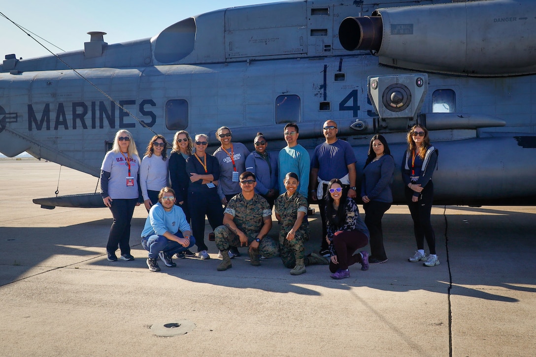 Educators and Marines with Recruiting Station Phoenix take a photo in front of a MV-22B Osprey on Marine Corps Air Station Miramar, Calif., April 10, 2025. Educators Workshop is a five-day immersive experience designed to inform educators, influencers, and local youth leaders about the benefits and opportunities available in the Marine Corps to better inform their students on career options. (U.S. Marine Corps photo by Sgt. Symira Bostic)