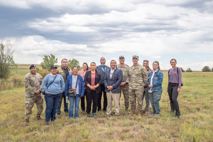 Members of Space Base Delta 41 pose with Tribal Historic Preservation Office members for a group photo.