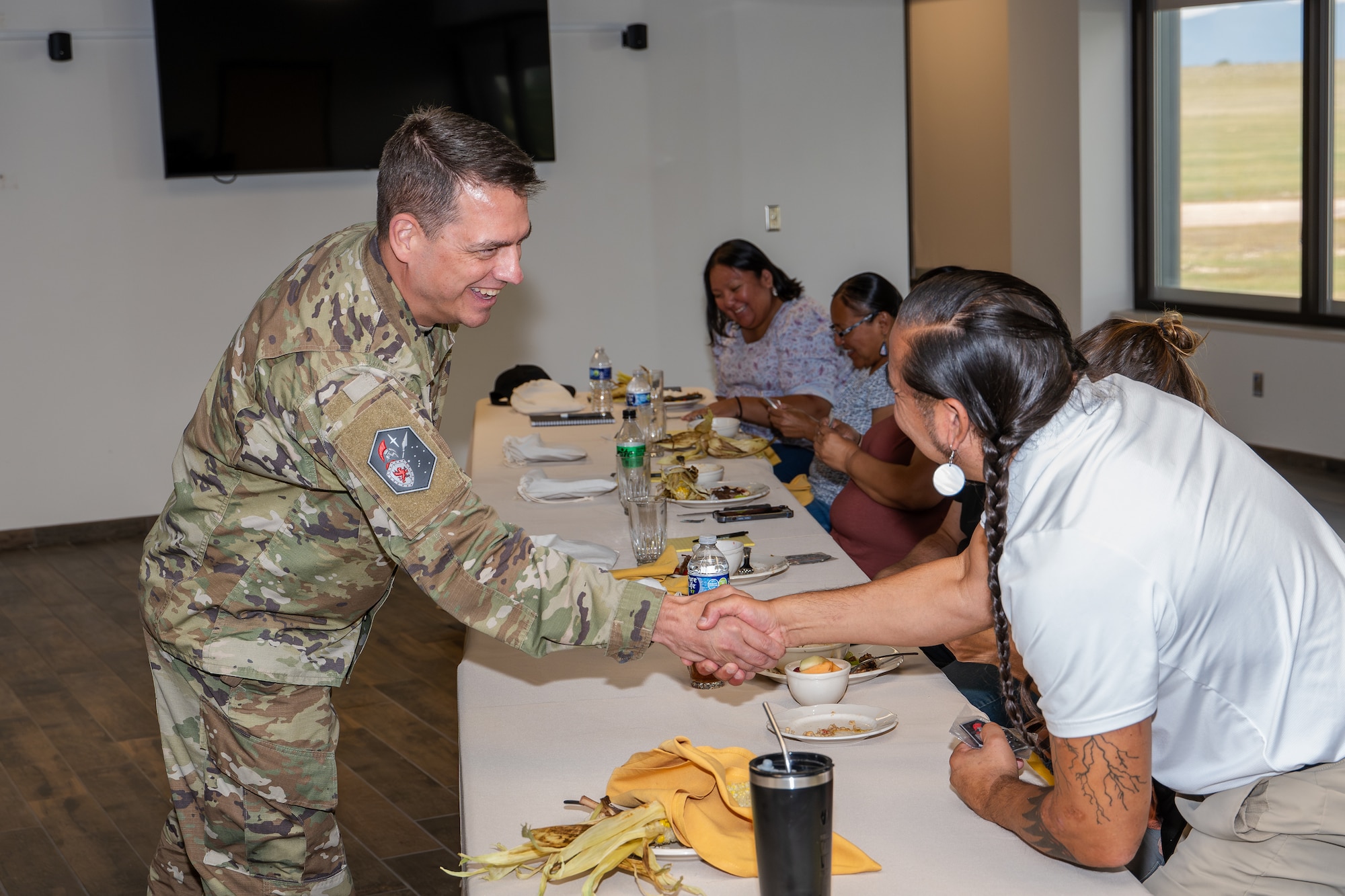Col. Eric Bogue gifts Allan Demaray, an SBD 41 unit patch.